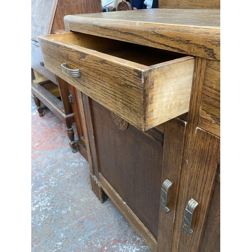 426 - An Art Deco oak sideboard - approx. 120cm wide x 98cm high x 46cm deep