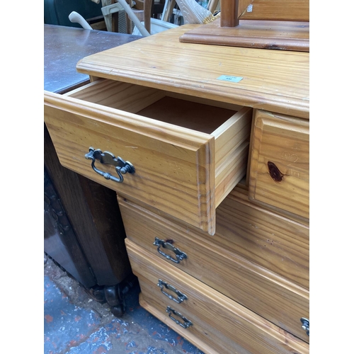 430 - A modern pine chest of drawers and a pine framed mirror - approx. 87cm wide x 101cm high x 45cm deep