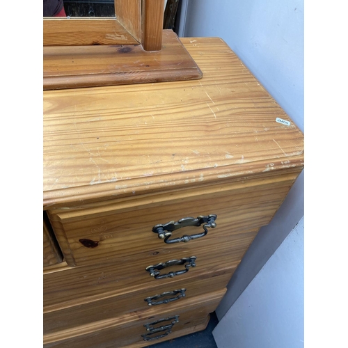 430 - A modern pine chest of drawers and a pine framed mirror - approx. 87cm wide x 101cm high x 45cm deep