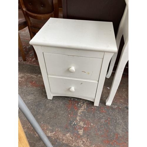 434 - Four items, a modern white dressing table, modern white two door cabinet and a pair of IKEA folding ... 