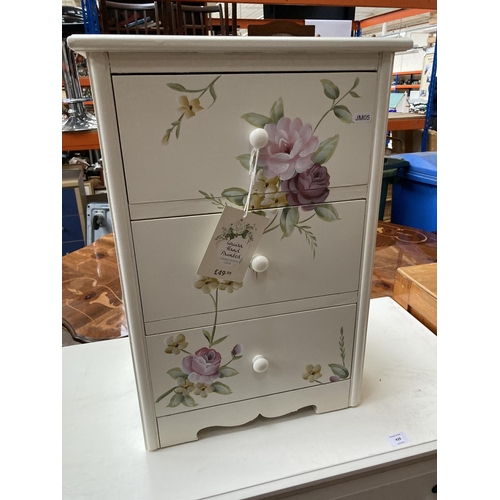 439 - Two items, a Dunelm Louisa hand painted cream three drawer bedside cabinet and a modern white chest ... 