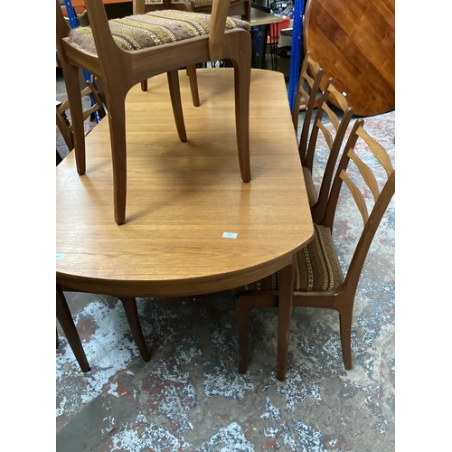 445 - A 1960s Sutcliffe S Form teak extending dining table and eight matching dining chairs to include two... 