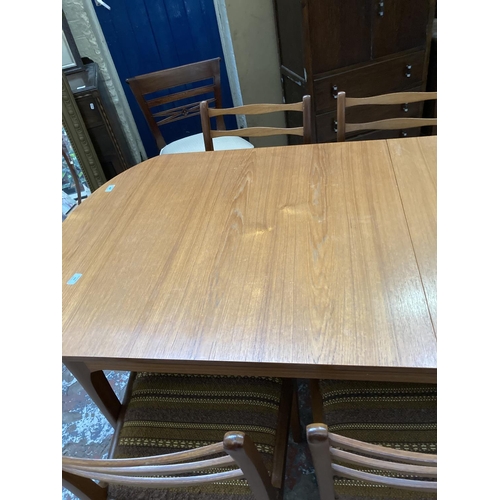 445 - A 1960s Sutcliffe S Form teak extending dining table and eight matching dining chairs to include two... 