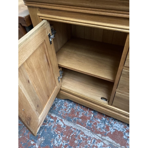 450 - A modern solid oak sideboard - approx. 151cm wide x 86cm high x 48cm deep