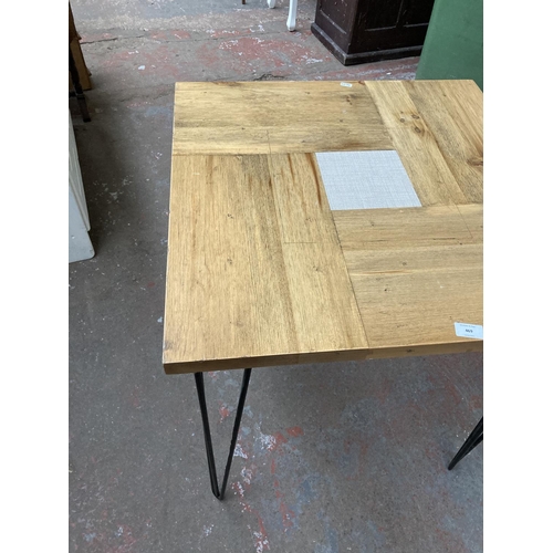 469 - A modern oak square bistro table on hairpin legs