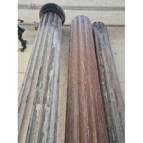 1080 - Three 19th century carved pitch pine corinthian columns to include two - approx. 9' high x 10