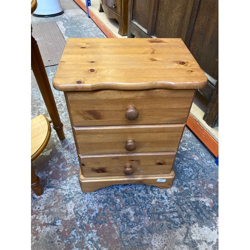 351 - Two items, a pine bedside chest of three drawers and a pine half moon console table