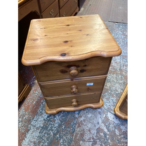 352 - A pair of modern pine three drawer bedside cabinets