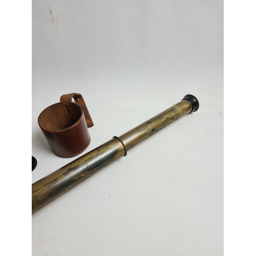 74 - A WW1 period brass three drawer military signalling telescope with brown leather cover by Dollond of... 