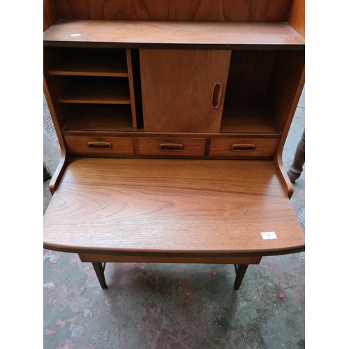 359 - A mid 20th century teak bureau