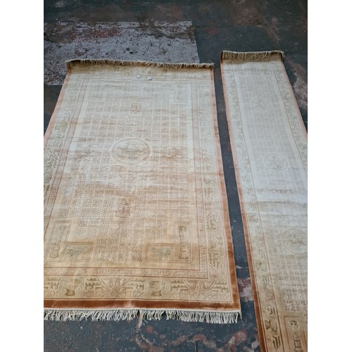 204A - A large Chinese silk and tassel rug - approx. 241cm long x 155cm wide and a matching hall runner - a... 