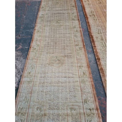 204A - A large Chinese silk and tassel rug - approx. 241cm long x 155cm wide and a matching hall runner - a... 