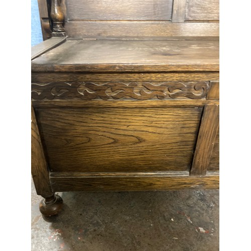 415 - An oak monks bench