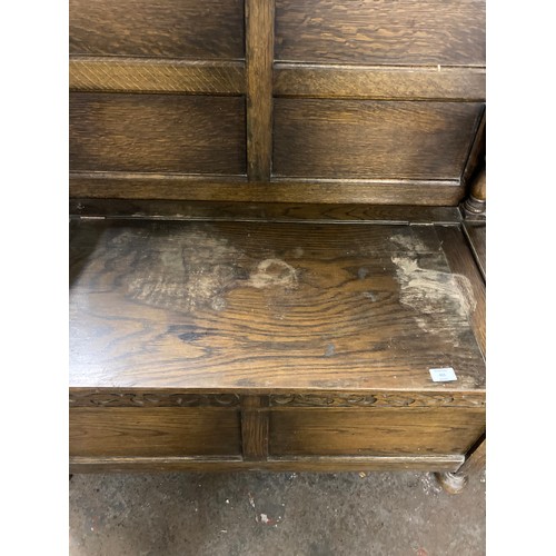 415 - An oak monks bench