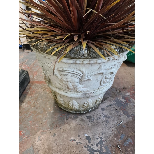 1245 - A large cast stone garden planter approx. 28