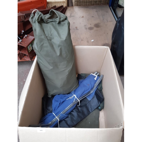 1262 - Six items, one box containing camping equipment to include bagged tent, camp bed, ground sheet, two ... 