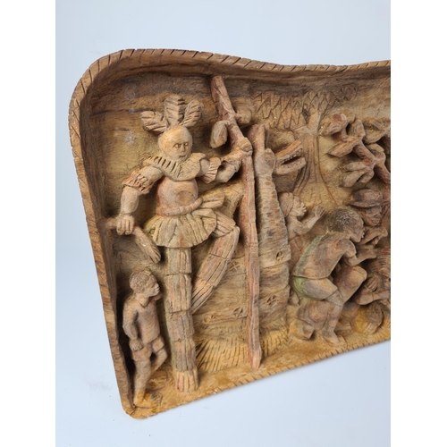 100 - A vintage African carved teak wall plaque with tribal relief - approx. 68cm wide x 32cm high