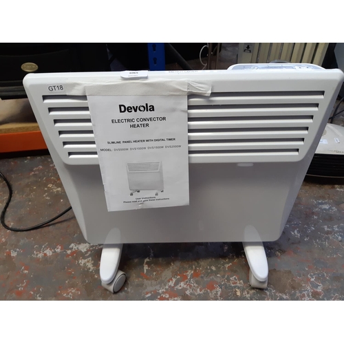 1065 - A Devola electric convector heater with digital timer and instruction manual