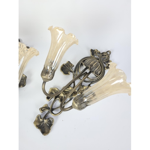 107 - Three Art Nouveau style brass wall sconces