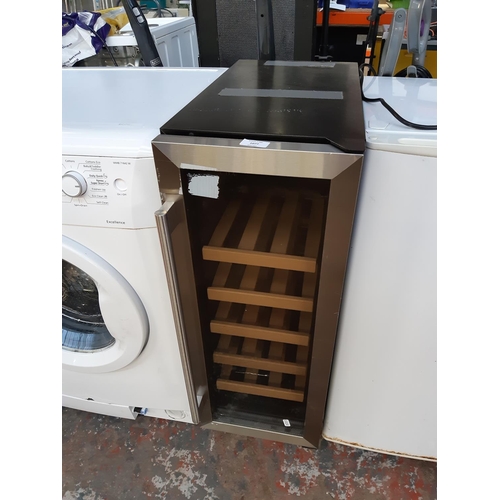 1077 - A black shop return 30cm under counter wine cooler with stainless steel and glass door