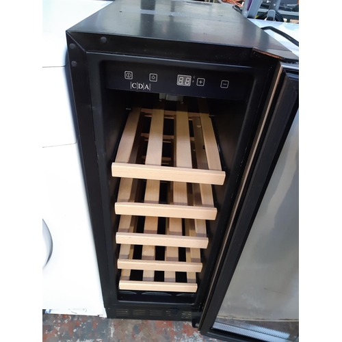 1077 - A black shop return 30cm under counter wine cooler with stainless steel and glass door