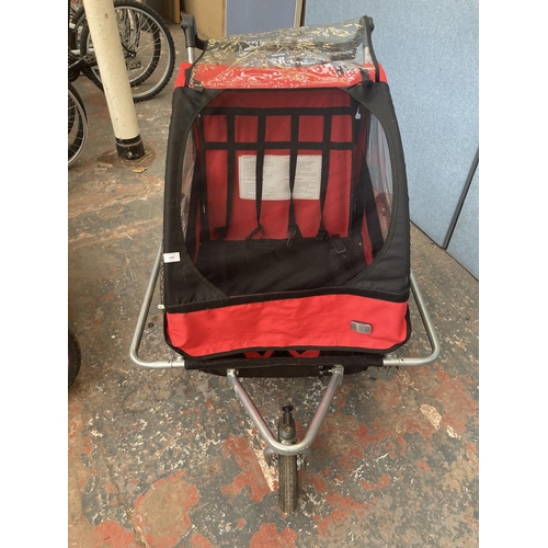 1102 - A black red and grey 2-in-1 two seat child's covered bike trailer/pushchair with suspension and brak... 