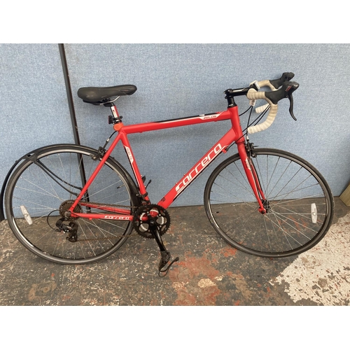 1104 - A black and red Carrera Zelos gent's lightweight racing bike with quick release wheels and 14 speed ... 