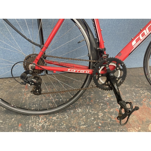 1104 - A black and red Carrera Zelos gent's lightweight racing bike with quick release wheels and 14 speed ... 