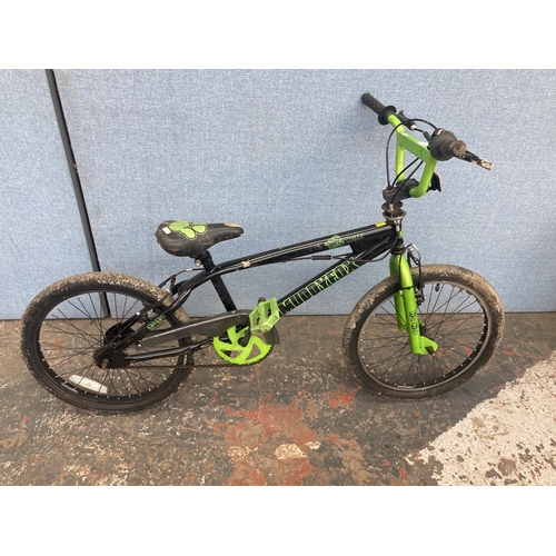 1109 - A black and green Muddy Fox Mutant BMX