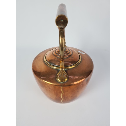 112 - A Victorian copper kettle with brass acorn finial