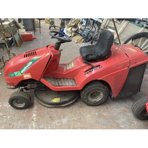 1122 - A red Countryside TCJ ride on tractor lawnmower with 12.5hp Briggs & Stratton engine, electric start... 