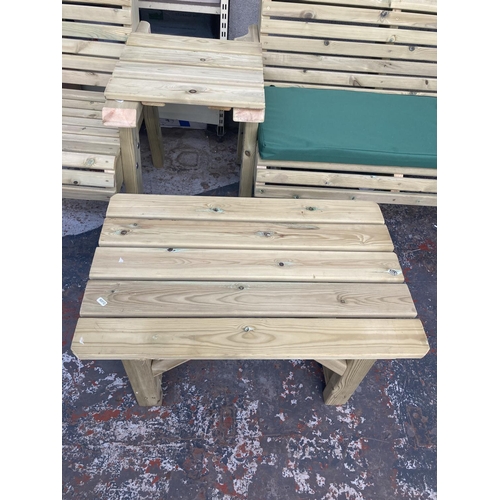 1132 - Four pieces of tanalised Swedish Redwood garden furniture, a two seat bench with cushion, matching a... 