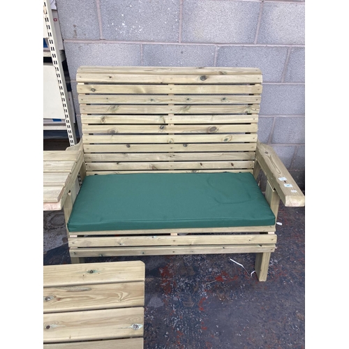 1132 - Four pieces of tanalised Swedish Redwood garden furniture, a two seat bench with cushion, matching a... 