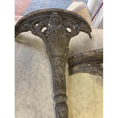 1138 - A Victorian style ornate cast iron three section circular table base with Brittania figure detail