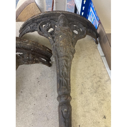 1138 - A Victorian style ornate cast iron three section circular table base with Brittania figure detail