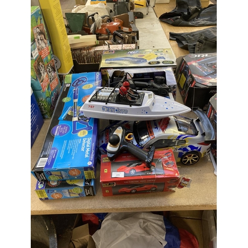 1201 - A selection of shop return toys to include Discovery digital metal detector, New Bright RC Bugatti V... 