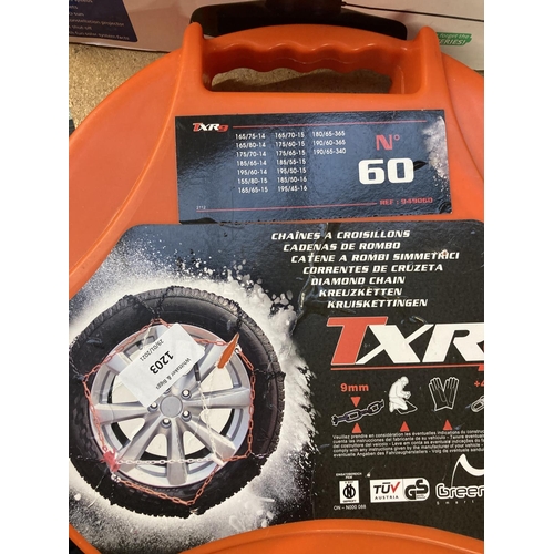 1203 - A cased pair of Green Valley TXR9 snow chains