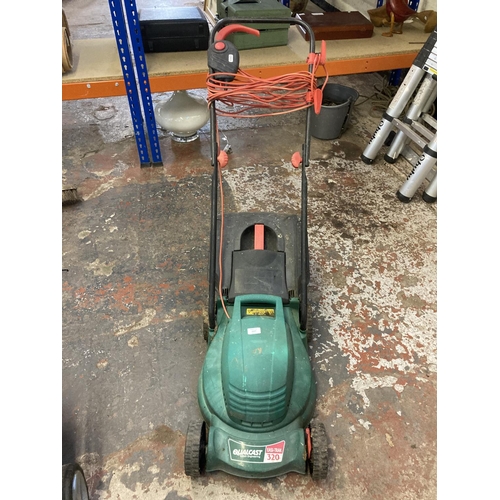 1227 - A black and green Qualcast Easi-Trak 320 electric lawnmower with grass collector