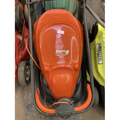 1230 - Two shop return electric lawnmowers, one black and green Qualcast and one orange and grey Flymo Easi... 