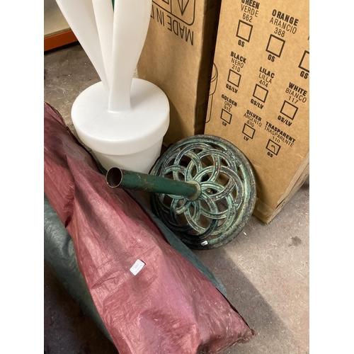 1242 - Four items, two boxed Myyour Tulip XL light up decorations approx. 5' high, one cast iron parasol ba... 