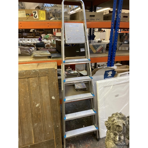 1249 - A set of Beldray six tread aluminium step ladders