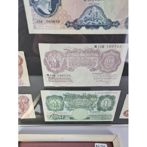 125 - Two frames containing a selection of vintage Bank of England notes