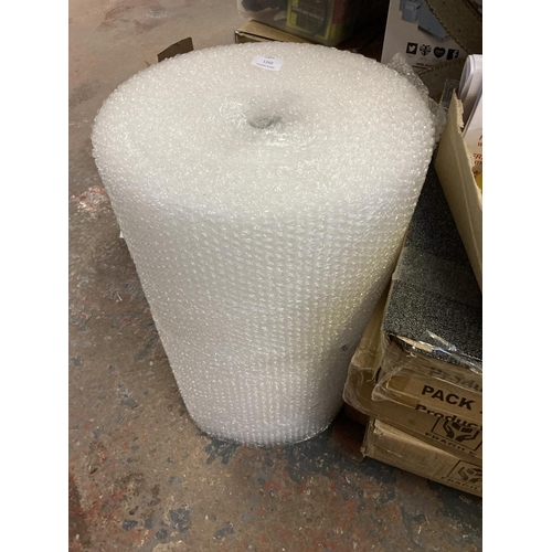 1260 - A mixed lot, 4 packs of 20 50cm x 50cm grey carpet tiles, one roll of bubble wrap, six rolls of pack... 