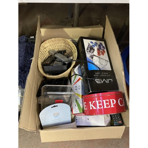 1264 - Four boxes containing stainless steel teapots, books, sewing equipment, clothing etc.