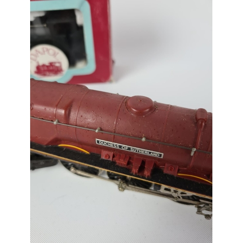 152 - Two items, a boxed Dapol OO gauge J94 BR black bunker and a Duchess of Sutherland locomotive and ten... 