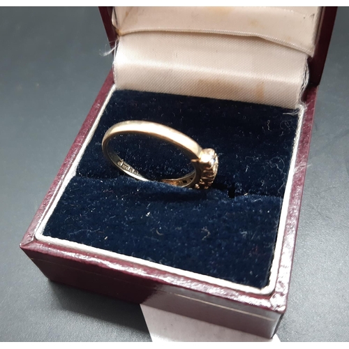 16 - A hallmarked 9ct gold ladies ring with seven inset cubic zirconia stones - size N ½ and approx. 2.5 ... 