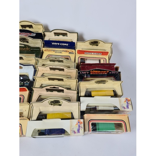 175 - A large quantity of boxed Lledo model vehicles