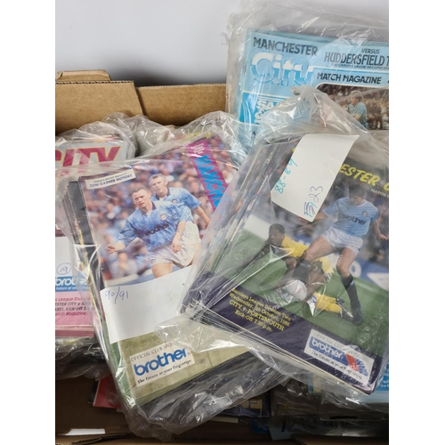 193 - An extensive collection of vintage football ephemera to include various match day programmes, Daily ... 