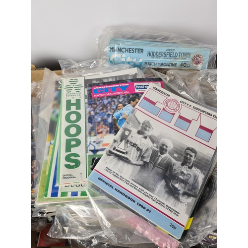 193 - An extensive collection of vintage football ephemera to include various match day programmes, Daily ... 