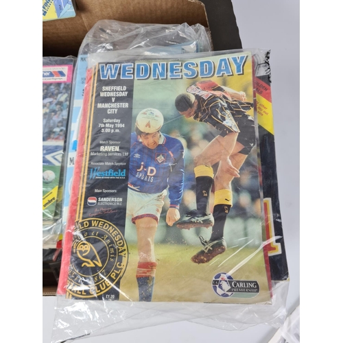 193 - An extensive collection of vintage football ephemera to include various match day programmes, Daily ... 